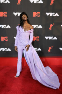 Last night's VMA Awards were awash with designer and couture, some attendees chose to honor the time-old tradition of stepping outside the norm to pay homage to fashions past and future with their daring looks. 2020's socially distanced show had to forgo its typical red carpet, so there was lost time to be made up for, and the message was certainly received. Most of these celebs contributed to the event in more ways than one, but their red carpet moments are what truly stole the show.