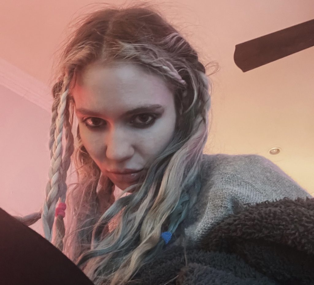 Fans of Grimes, get your headphones and galactic makeup ready. The artist has revealed the cover art of her newest song, “Shinigami Eyes,” Monday morning.