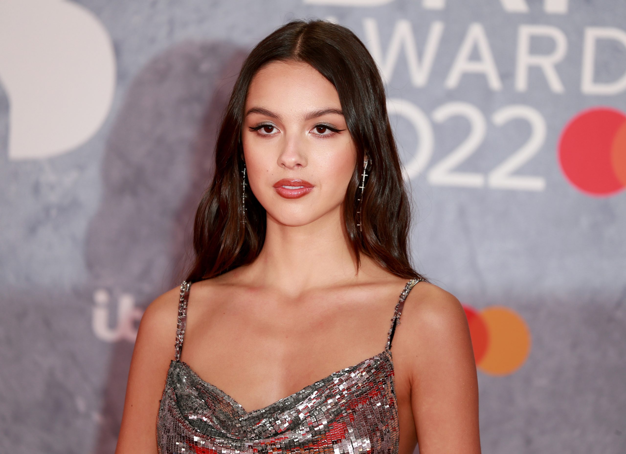 Taking on the title as the official 2022 'Woman of the year', Olivia Rodrigo continues being a fashion icon in her newly shared photos. Her most recent Instagram post features the pop sensation in a stunning green coat and fun hair accessories.