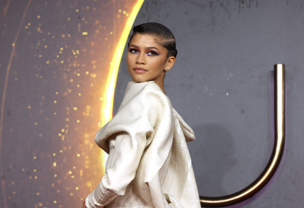 In a recent cover story for W Magazine, Zendaya strikes a series of ethereal poses and discusses everything from Dune to film anxiety to acting spontaneity. The ‘Directors Issue,’ conceptualized by French Canadian filmmaker Dennis Villeneuve, was released this Thursday and features a variety of futuristic shots of the Hollywood starlet. A homage to David Bowie in The Man Who Fell to Earth, Villeneuve wanted Zendaya to embody a celestial lifeform discovering our decrepit planet thousands of years from now. 