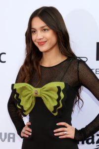 Taking on the title as the official 2022 'Woman of the year', Olivia Rodrigo continues being a fashion icon in her newly shared photos. Her most recent Instagram post features the pop sensation in a stunning green coat and fun hair accessories.