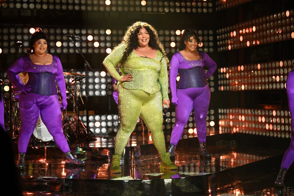 Lizzo released the official music video for her new hit single “About Damn Time” on April 14 and the vibes were electric. Donning a glittery blue bodysuit, fabulous beehive updo, and white go-go boots, the Grammy winner stunned while singing this summer anthem.