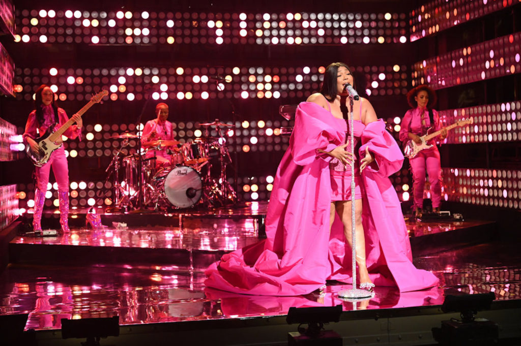 Lizzo released the official music video for her new hit single “About Damn Time” on April 14 and the vibes were electric. Donning a glittery blue bodysuit, fabulous beehive updo, and white go-go boots, the Grammy winner stunned while singing this summer anthem.