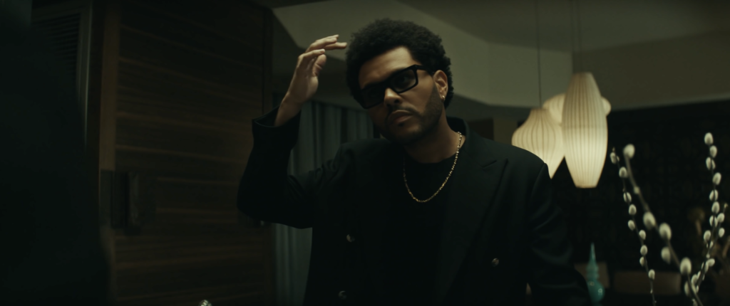 The Weeknd dropped the official music video for his hit song “Out of Time” on Tuesday, and the two guest appearances were everything. Starring opposite Squid Game star Jung Ho-yeon, The Weeknd engages in a night of karaoke and playful flirtation with his newfound love interest. 