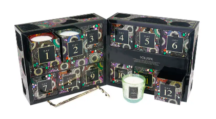 The Voluspa Japonica Advent Calendar Candle Set features many of Voluspa Japonica's signature candles. Voluspa is known for its specialty, coconut wax, which burns 90% cleaner than other candle wax blends. These candles smell like fall and winter, and not only does this gift set have candles, but it also includes a Wick Trimmer. Get the exclusive set here, which is priced at $158.