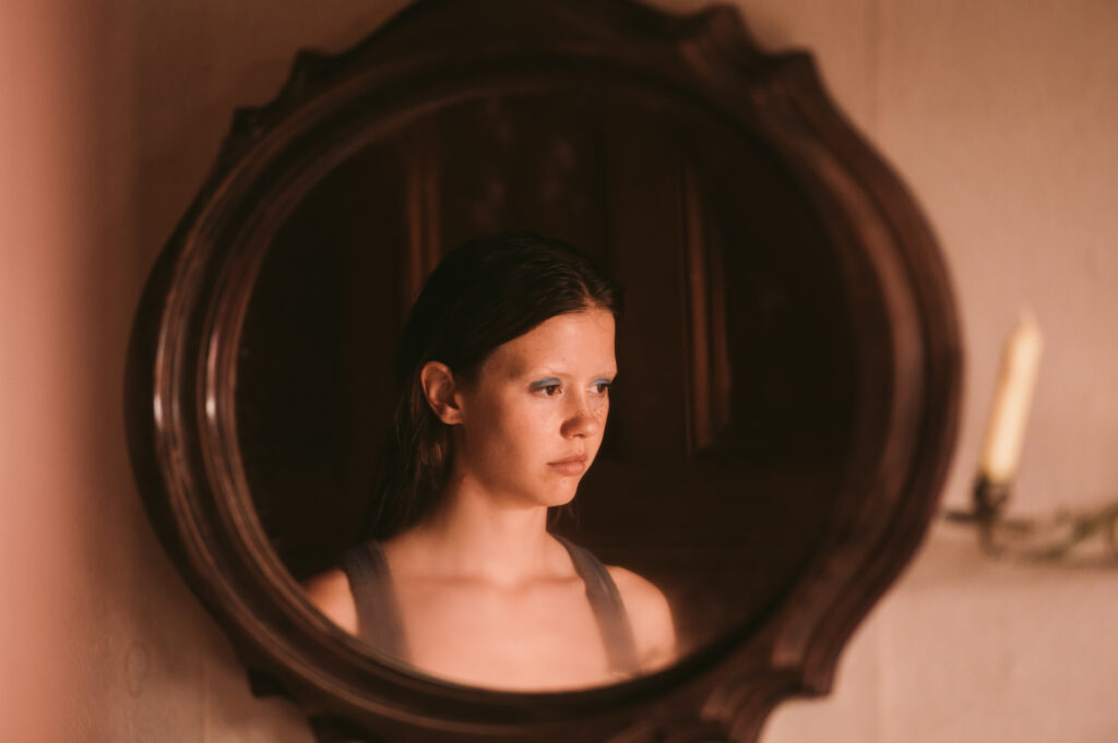 'MaXXXine,' the third installment of Mia Goth and Ti West's horror franchise, has found its stellar cast, featuring Elizabeth Debicki, Lily Collins, Giancarlo Esposito, and more.