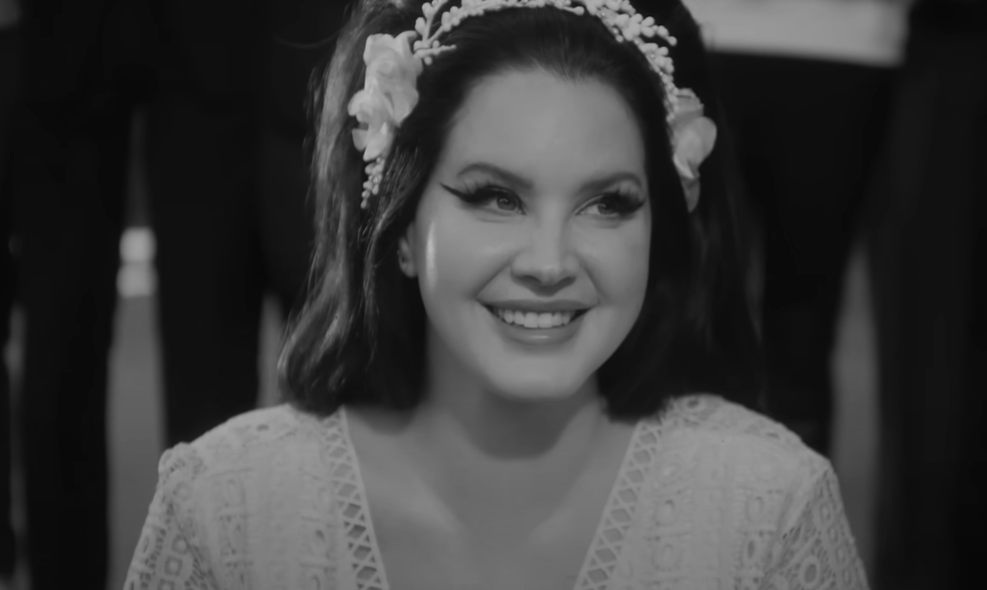 Lana Del Rey channels old Hollywood glamour in her haunting new music video for “Candy Necklace” featuring Grammy-winning artist, Jon Batiste.