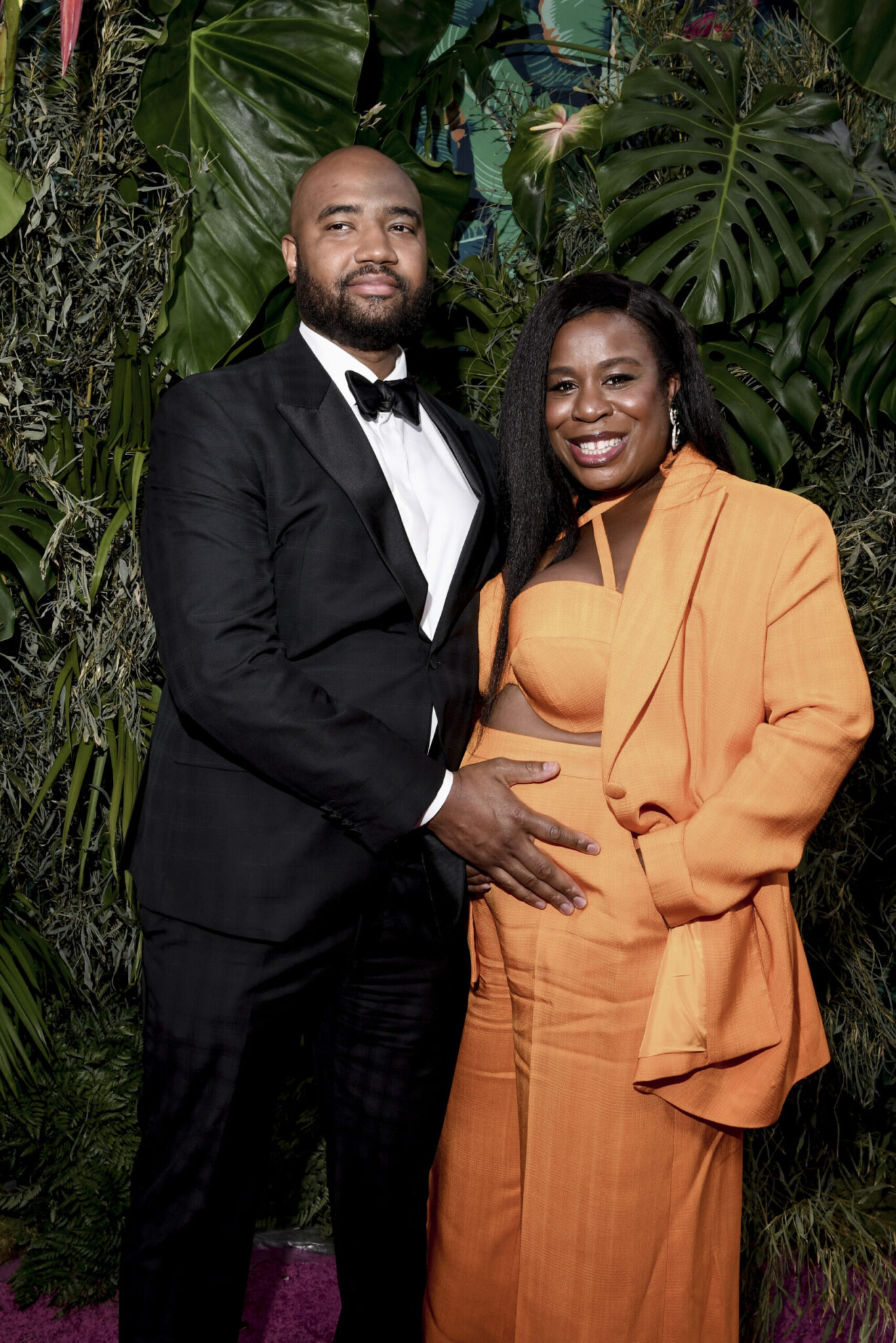 Orange Is the New Black star, Uzo Aduba, revealed her baby bump at the 2023 Tony Awards in a bright orange Christian Siriano suit.