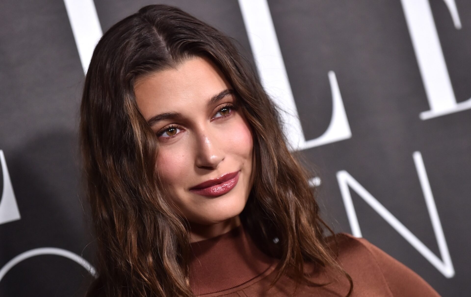 Hailey Bieber is cozying up for fall and spending it, like most of us, binging Gilmore Girls. Bieber's adorable new Instagram post shares her Rory-inspired outfit.