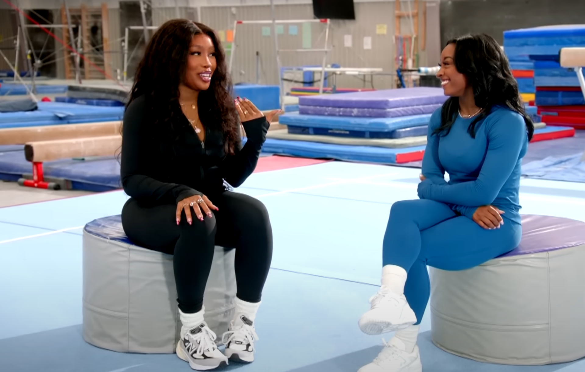 Leading up to the 2024 Olympics, SZA challenges Simone Biles to a handstand competition and shares about her past as a gymnast.