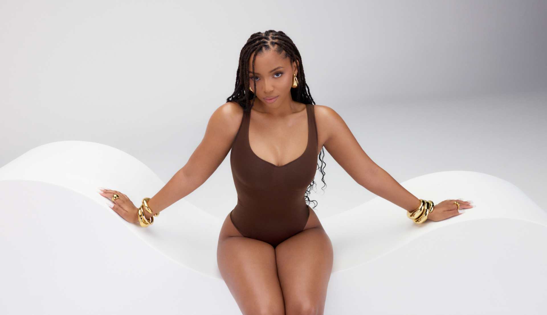 Lizzo has returned with a new Yitty campaign featuring Chloe Bailey. The campaign promotes the new collection, Nearly Naked, in fashionable loungewear. 