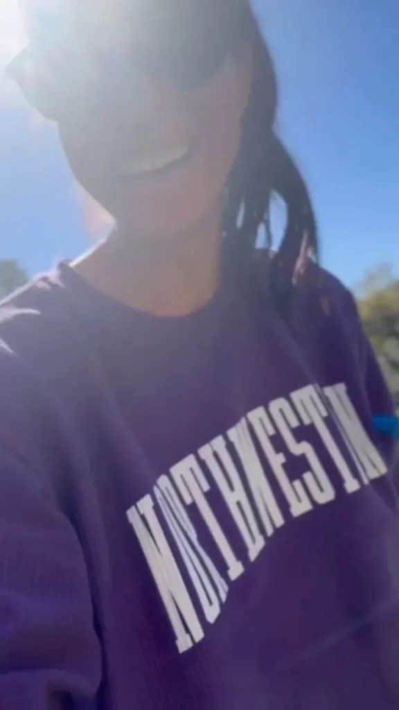 Meghan Markle knows how to keep the world watching. Over the weekend, the Duchess of Sussex took to Instagram to share a glimpse of her sun-soaked California life, wearing a cozy purple Northwestern University sweatshirt while watering the garden with one of her children.