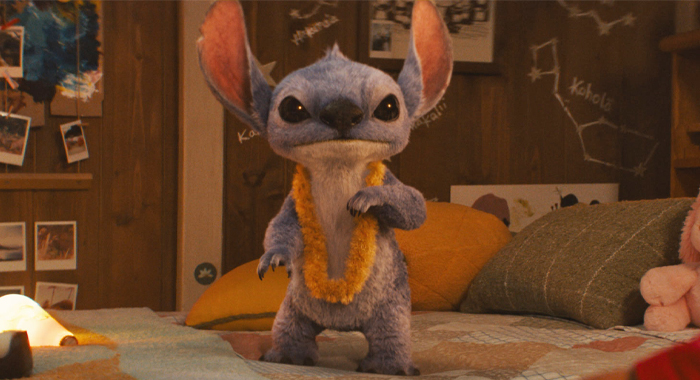 Stitch surprised guests by scanning tickets at theaters, bringing laughter and excitement as part of a fun promotion for the upcoming live-action Lilo & Stitch film.