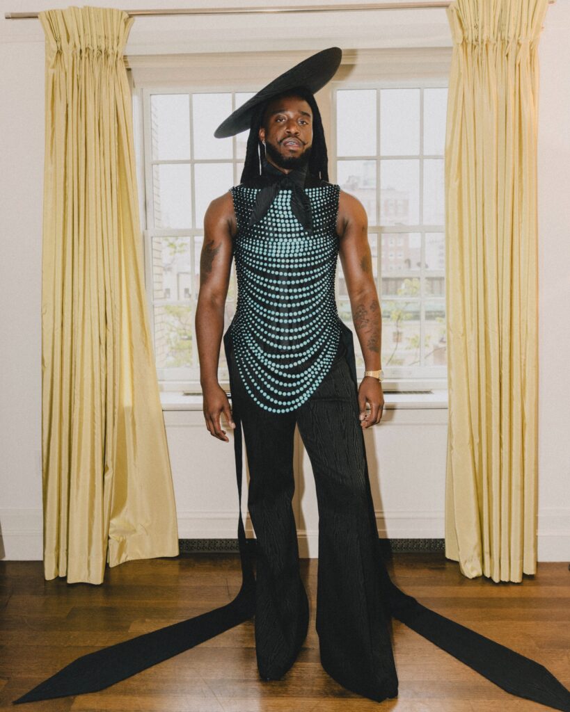 The Met Gala delivered a night of powerful style statements, historical tributes, and boundary-pushing couture under the theme "Superfine: Tailoring Black Style." The exhibit, curated by the Costume Institute, explored the art of Black dandyism, heritage dressing, and personal tailoring as a cultural language. This year’s dress code, "Tailored for You," encouraged guests to not just dress up—but dress with purpose.
From zoot suits to surrealist armor, and from Harlem-inspired outerwear to ruler-constructed couture, the red carpet became a living archive of personal expression. This year’s theme, “Superfine: Tailoring Black Style,” spotlighted the deep influence of Black fashion across centuries—where tailoring has served not just as clothing, but as identity, resistance, and celebration. With co-chairs Colman Domingo, Lewis Hamilton, A$AP Rocky, Pharrell Williams, and Anna Wintour, the night honored style rooted in the African diaspora while embracing a future shaped by reinvention and self-definition. LeBron James served as an honorary chair but canceled his appearance due to a knee injury.
Designers such as Ruth E. Carter, Michael Kors, Thom Browne, Pieter Mulier for Alaïa, Anthony Vaccarello for Saint Laurent, and Olivier Rousteing lent their vision to the evening’s most memorable looks, many of them merging costume with cultural context.
Below, we break down the standout looks from the night, each interpreted with editorial flair and cultural relevance.