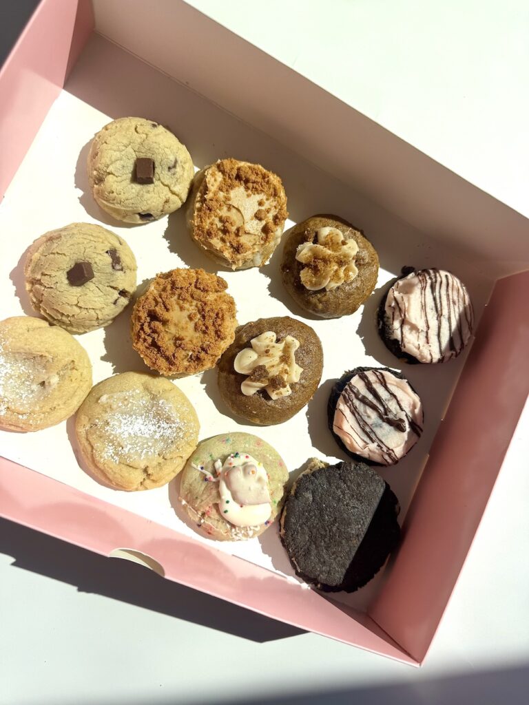 If you’ve ever wanted to taste everything on the menu without the sugar crash that follows, Crumbl just heard your prayers. This week, the beloved bakery dropped a dazzling lineup of its cookies in an irresistible new form: the Mini 12-Pack. Think couture sweets—bite-sized, petite, but every bit as indulgent as their oversized siblings.