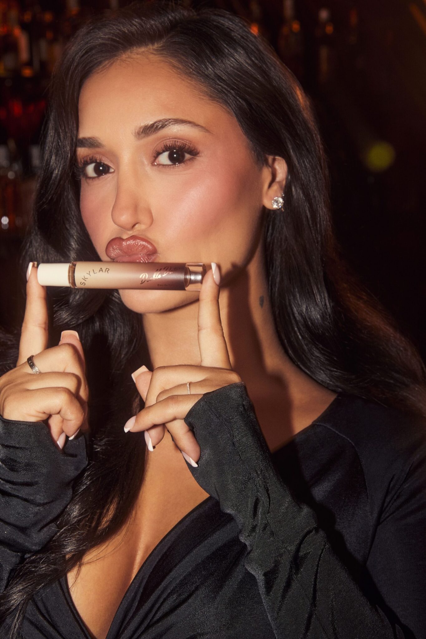 Feel that first hint of a chill in the air? We do too—and it’s the perfect cue to start leaning into all things fall. Time to tuck away the breezy bandeau tops and pull out those cozy, oversized sweaters. Trade in your summer peachy blush for toasted, autumnal tones that warm up the complexion, and swap those bright, fruity fragrances for something richer, spicier, and a little more comforting. The season of layering, moody hues, and inviting scents has officially arrived.