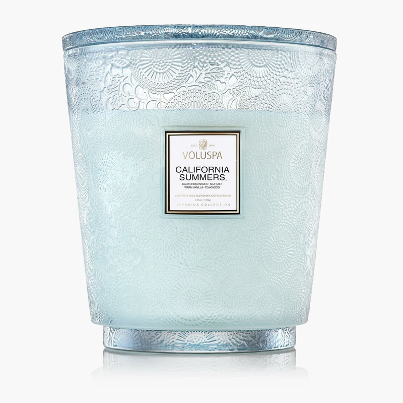 Scent is memory. I've said it about perfume and I'll say it about candles, because the fastest way to change how a room feels is to light one and walk out for ten minutes. Come back and the whole space has a mood. These are the five burning in my house this summer. One cult classic, one coastal escape, one Parisian café, one absolute wildcard, and one icon. No ranking — just five different rooms, five different afternoons.