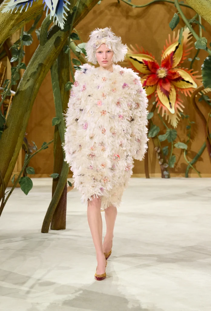 On the second day of Paris Haute Couture Week, creative director Matthieu Blazy unveiled his second couture collection for the House, and darling, he did not come to play it safe. Titled "Gaby and the Beanstalk," the Fall/Winter 2026-2027 collection was born from a book of fairytales — Les Fées, Contes des Contes — that Blazy discovered tucked away in Gabrielle Chanel's personal library. From that single spark, he built an entire enchanted world inside the Grand Palais.